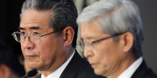 Takuo Sasaki, managing officer of Toyota Motor Corp., left, and Nobuyori Kodaira, executive vice president, attend a news conference in Tokyo, Japan, on Wednesday, Nov. 6, 2013. Toyota, the worlds largest automaker, raised its full-year profit forecast by 13 percent as the weaker yen boosted earnings from Prius and Lexus vehicles exported from Japan. Photographer: Junko Kimura/Bloomberg via Getty Images