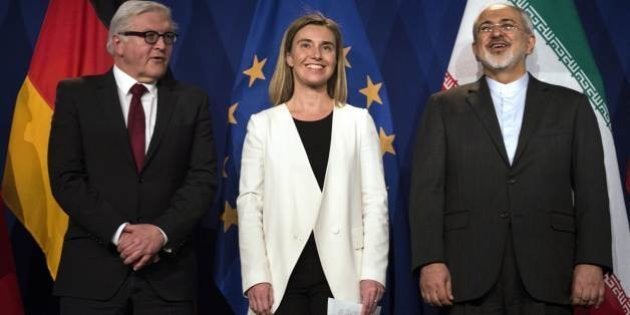 Iranian Foreign Minister Javad Zarif, right, waits to make a statement flanked by German Foreign Minister Frank Walter Steinmeier, left and European Union High Representative for Foreign Affairs and Security Policy Federica Mogherini, at the Swiss Federal Institute of Technology, or Ecole Polytechnique Federale De Lausanne, in Lausanne, Switzerland, Thursday, April 2, 2015, after Iran nuclear program talks finished with extended sessions. The United States, Iran and five other world powers on Thursday announced an understanding outlining limits on Iran's nuclear program so it cannot lead to atomic weapons, directing negotiators toward achieving a comprehensive agreement within three months. (AP Photo/Brendan Smialowski, Pool)