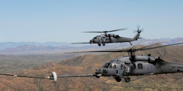 April 15, 2010 - Two HH-60 Pave Hawks refuel over the desert surrounding Davis-Monthan Air Force Base, Arizona, during Angel Thunder 2010.