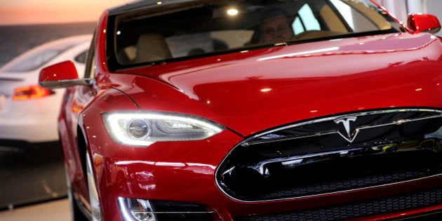 A Tesla Motors Inc. vehicle is displayed during the 2013 North American International Auto Show (NAIAS) in Detroit, Michigan, U.S., on Tuesday, Jan. 15, 2013. The Detroit auto show runs through Jan. 27 and will display over 500 vehicles, representing the most innovative designs in the world. Photographer: David Paul Morris/Bloomberg via Getty Images