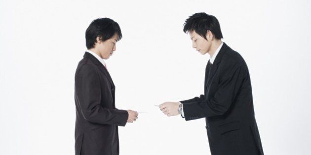 Businessmen exchanging cards
