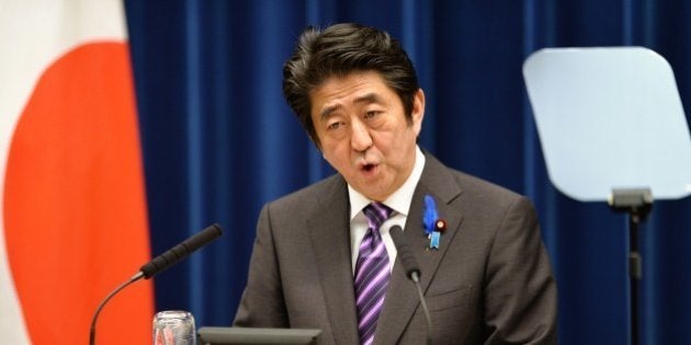 Japanese Prime Minister Shinzo Abe speaks during a press conference at his official residence in Tokyo on July 1, 2014. Japan on July 1 loosened the binds on its powerful military, proclaiming the right to go into battle in defence of allies, in a highly controversial shift in the nation's pacifist stance. AFP PHOTO / KAZUHIRO NOGI (Photo credit should read KAZUHIRO NOGI/AFP/Getty Images)