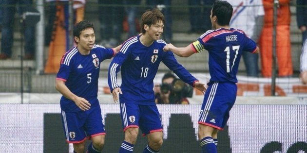 (L-R) Yuto Nagatomo of Japan, Yuya Osako of Japan, Makoto Hasebe of Japan during the friendly match between Japan and Netherlands at Cristal Arena on November 16, 2013 in Genk, Belgium(Photo by VI Images via Getty Images)