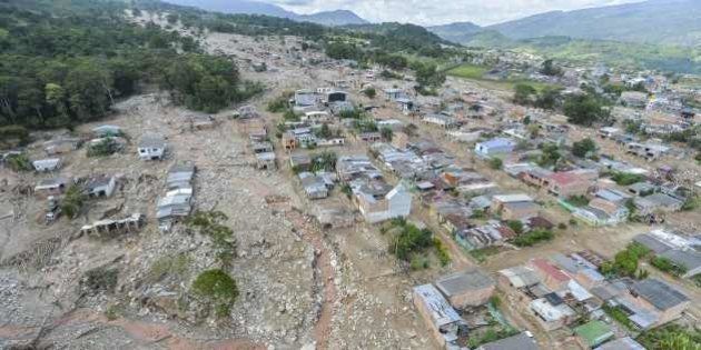 Aerial view of the extensive damage caused by mudslides as a result of heavy rains, in Mocoa, Putumayo department, Colombia on April 3, 2017.Rescuers clawed through mud and timber Monday searching for survivors of a mudslide in southern Colombia that killed 262 people, including 43 children, and left relatives desperately seeking loved ones. / AFP PHOTO / LUIS ROBAYO (Photo credit should read LUIS ROBAYO/AFP/Getty Images)
