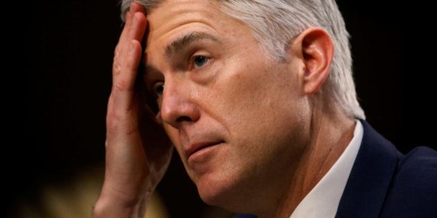 U.S. Supreme Court nominee judge Neil Gorsuch listens to a question as he testifies during the third day of his Senate Judiciary Committee confirmation hearing on Capitol Hill in Washington, U.S., March 22, 2017. REUTERS/Jim Bourg