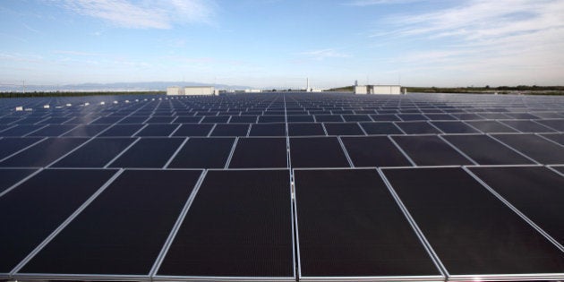 Solar panels manufactured by Sharp Corp. stand at Kansai Electric Power Co.'s mega solar power station in Sakai City, Osaka, Japan, on Tuesday, Oct. 5, 2010. The Japanese energy company started the commercial operation of the solar power station today. Photographer: Tomohiro Ohsumi/Bloomberg via Getty Images