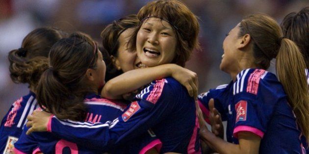 Japan's midfielder Mizuho Sakaguchi celebrates her goal against Netherlands with teammates during the round of 16 football match between Japan and the Netherlands at BC Place Stadium in Vancouver during the FIFA Women's World Cup Canada 2015 on June 23, 2015. AFP PHOTO/ANDY CLARK (Photo credit should read ANDY CLARK/AFP/Getty Images)