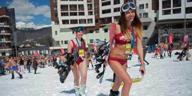 SOCHI, RUSSIA - APRIL 1, 2017: People dressed in swimsuits participate in the BoogelWoogel alpine carnival at the Rosa Khutor Alpine Resort in Krasnaya Polyana, Sochi. Artur Lebedev/TASS (Photo by Artur Lebedev\TASS via Getty Images)