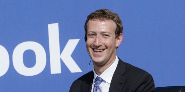 Facebook CEO Mark Zuckerberg smiles while speaking at Facebook in Menlo Park, Calif., Sunday, Sept. 27, 2015. A rare visit by Indian Prime Minister Narendra Modi this weekend has captivated his extensive fan club in the area and commanded the attention of major U.S. technology companies eager to extend their reach into a promising overseas market. (AP Photo/Jeff Chiu)