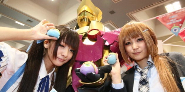 KYOTO, JAPAN - SEPTEMBER 08: Cosplayers pose for photo during Kyoto International Manga Anime Fair 2013 at Miyako Messe on September 8, 2013 in Kyoto, Japan. (Photo by Ken Ishii/Getty Images for Toyota)