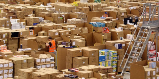 SWANSEA, WALES - NOVEMBER 24: Staff at the Amazon Swansea fulfilment centre process orders as they prepare their busiest time of the year on November 24, 2011 in Swansea, Wales. The 800,000 sq ft fulfilment centre, one the largest of Amazon's six in the UK and the also the world, is gearing up for for both 'Black Friday' and 'Cyber Monday'. Black Friday is traditionally the discount shopping day that follows Thanksgiving in America and signals the start of the Christmas shopping period. In 2010 it is was reported that over 45bn USD was spent by shoppers in America over 'Black Friday' weekend. Cyber Monday, which this year is Monday December 5, and is predicted to be the UK's busiest online shopping day of the year with over 2 million orders expected to be made. (Photo by Matt Cardy/Getty Images)