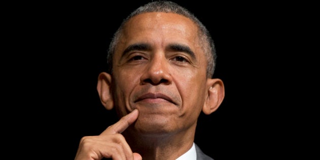 In this June 17, 2015, photo, President Barack Obama looks out as he sits on stage as Attorney General Loretta Lynch speaks during her investiture ceremony at the Warner Theatre in Washington. Critics have long predicted that Obamaâs policy to shift Americaâs focus toward Asia is doomed. The legislative battle over his trade agenda could prove the acid test. (AP Photo/Carolyn Kaster)