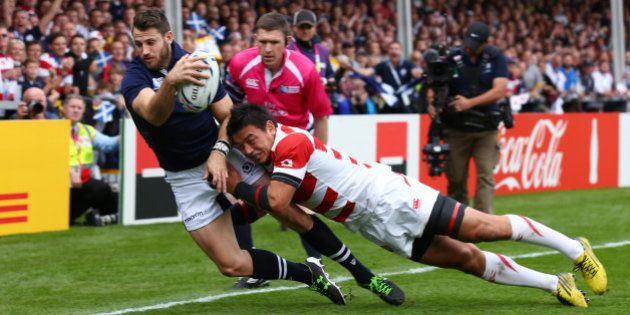 GLOUCESTER, ENGLAND - SEPTEMBER 23: Tommy Seymour of Scotland is tackled by Ayumu Goromaru of Japan as he fails to go over for a try during the 2015 Rugby World Cup Pool B match between Scotland and Japan at Kingsholm Stadium on September 23, 2015 in Gloucester, United Kingdom. (Photo by Steve Bardens - World Rugby/World Rugby via Getty Images)