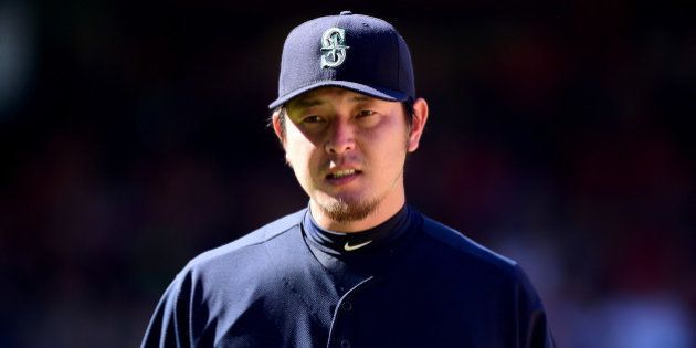 ANAHEIM, CA - SEPTEMBER 27: Hisashi Iwakuma #18 of the Seattle Mariners reacts as he leaves the game during the eighth inning at Angel Stadium of Anaheim on September 27, 2015 in Anaheim, California. (Photo by Harry How/Getty Images)