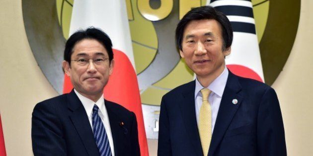 South Korean Foreign Minister Yun Byung-Se (R) shakes hands with his Japanese counterpart Fumio Kishida (L) during their meeting at the foreign ministry in Seoul on March 21, 2015. The foreign ministers of South Korea, Japan and China gathered in Seoul for their first meeting in nearly three years, aimed at calming regional tensions rooted in territorial and other diplomatic disputes. AFP PHOTO / POOL / JUNG YEON-JE (Photo credit should read JUNG YEON-JE/AFP/Getty Images)