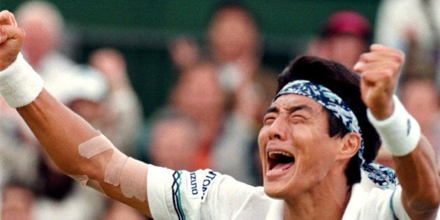 Japan's Shuzo Matsuoka celebrates his victory in the fourth round of the Wimbledon tennis championships July 3