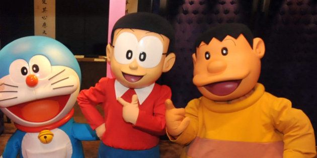 Doraemon (C), Japan's robot cat from the future, and the other characters of the popular manga strips created in 1969, pose for photos during a pre-show press conference in Taipei on December 3, 2012. The show, about Doraemon and the rest of Japanese cartoon characters in the manga strips, will be held in Taipei from December 29 through April 7, 2013. The cartoon exploits of the electronic feline have captivated children across Asia. AFP PHOTO / Mandy CHENG (Photo credit should read Mandy Cheng/AFP/Getty Images)