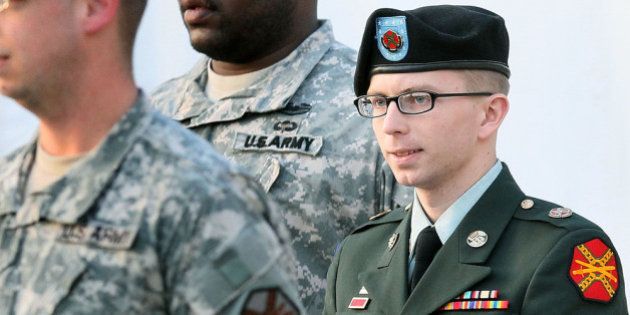 FORT MEADE, MD - FEBRUARY 23: Army Private Bradley Manning is escorted away from his Article 32 hearing February 23, 2012 in Fort Meade, Maryland. During the hearing, Manning deferred his plea to the 22 charges against him and deferred a decision over whether he wanted a military judge or a jury to hear his case. (Photo by Mark Wilson/Getty Images)