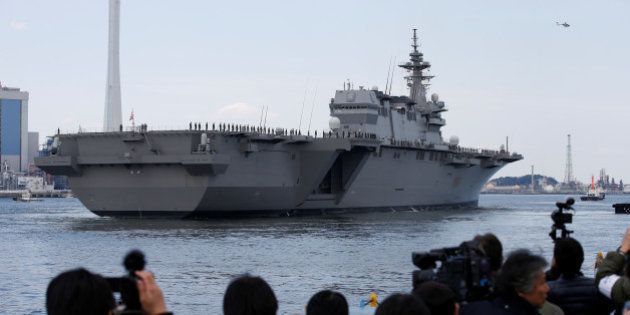 Japan Maritime Self-Defense Force's (JMSDF) latest Izumo-class helicopter carrier DDH-184 Kaga leaves a port after a handover ceremony for the JMSDF by Japan Marine United Corporation in Yokohama, Japan March 22, 2017. REUTERS/Toru Hanai