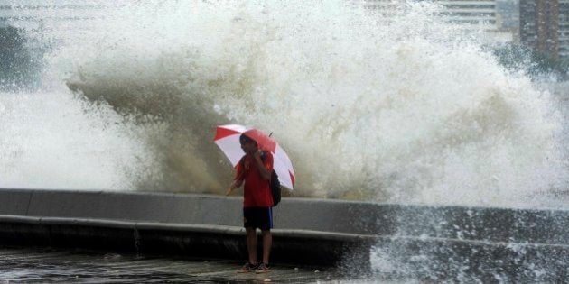 MUMBAI, INDIA JULY 24: Heavy rain and High Tide lashes Mumbai city causing water logging on many roads and disturbing daily life of Mumbai on the morning of 24th July 2013.(Photo by Mandar Deodhar/India Today Group/Getty Images)