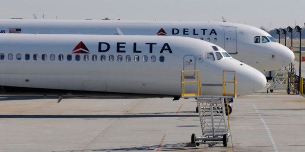 A Delta Airlines MD-88 (foreground) with Airbus A320 (background) at Hartsfield-Jackson International Airport in Atlanta , Georgia, December 9, 2011. REUTERS/Tami Chappell (UNITED STATES)