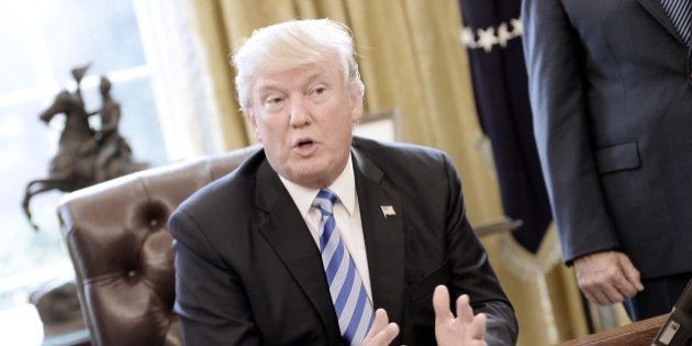 WASHINGTON, DC - MARCH 24: U.S. President Donald Trump reacts after Republicans abruptly pulled their health care bill from the House floor, in the Oval Office of the White House on March 24, 2017 in Washington, DC. In a big setback to the agenda of President Donald Trump and the Speaker, Ryan cancelled a vote for the American Health Care Act, the GOP plan to repeal and replace the Affordable Care Act, also called 'Obamacare.' (Photo by Olivier Douliery-Pool/Getty Images)