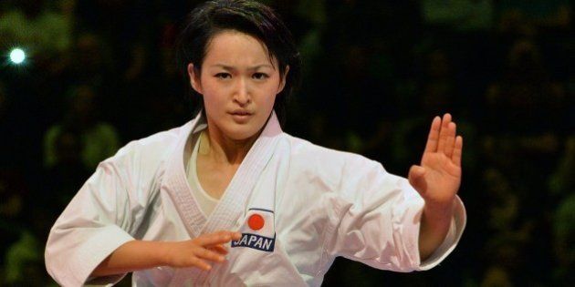 Kiyou Shimizu (L) from Japan competes to win the final against Sandy Scordo from France in the female individual kata competition of the 22nd Karate World Championships at OVB-Arena on November 9, 2014 in Bremen, Germany. AFP PHOTO / CARMEN JASPERSEN (Photo credit should read CARMEN JASPERSEN/AFP/Getty Images)