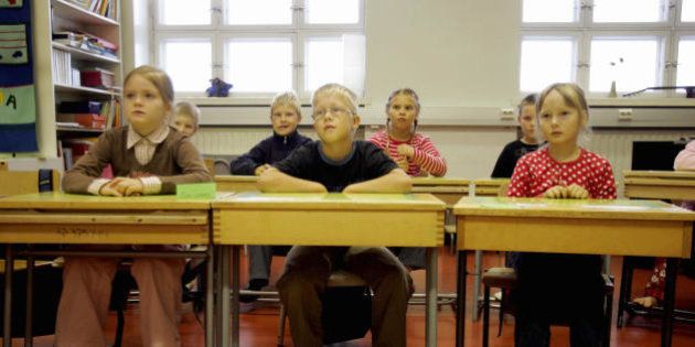 Vaasa (Vasa), FINLAND: Children listen to their teacher 17 August 2005 in a primary school in Vaasa, on the second day of school in Finland. Because of the track and field World Championships in Helsinki, most of the schools have postponed by one week opening of their new season. According to a recent European study, Finland is the country which has best school results in Europe thanks to its teaching system. AFP PHOTO OLIVIER MORIN (Photo credit should read OLIVIER MORIN/AFP/Getty Images)