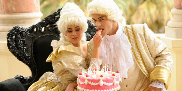 Marie Antoinette feeding her king with her birthday cake