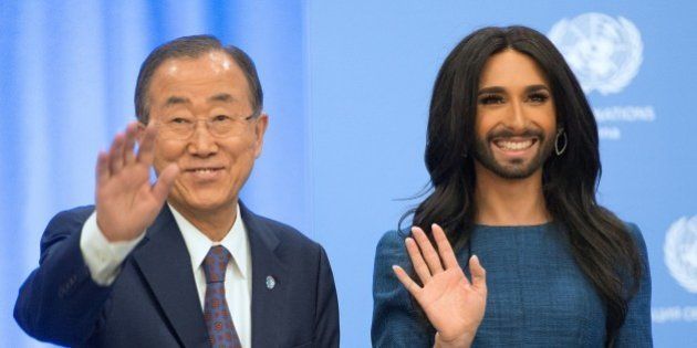 UN General Secretary Ban Ki-moon (L) and Austrian transvestite singer Conchita Wurst wave at the United Nations headquarters in Vienna, on November 3, 2014, as they meet on the occasion of UN chief's speech on tolerance and the rights of homosexuals. Thomas 'Tom' Neuwirth, better known by his drag stage persona Conchita Wurst, came to international attention when winning the Eurovision Song Contest 2014 with the song 'Rise Like a Phoenix'. AFP PHOTO/JOE KLAMAR (Photo credit should read JOE KLAMAR/AFP/Getty Images)