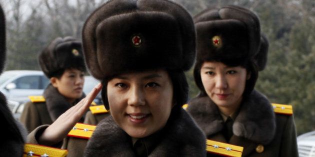 Members of the Moranbong Band and the State Merited Chorus of North Korea leave the station in Pyongyang, North Korea, Wednesday, Dec. 9, 2015. They give friendship performances in China. (AP Photo/Kim Kwang Hyon)