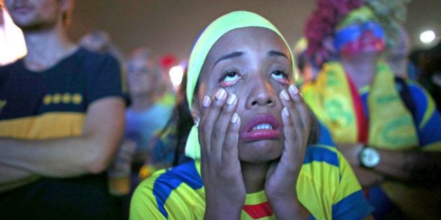 RIO DE JANEIRO, BRAZIL - JUNE 20: An Ecuador soccer team fan reacts while watching a play against the Honduras team at the Word Cup FIFA Fan Fest during on Copacabana beach June 20, 2014 in Rio de Janeiro, Brazil. (Photo by Joe Raedle/Getty Images)