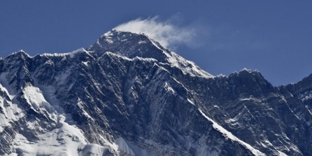 This picture taken on April 20, 2015 shows a view of Mount Everest (Background) and Nupse (Foreground) taken from the village of Tembuche in the Kumbh region of north-eastern Nepal. AFP PHOTO / ROBERTO SCHMIDT (Photo credit should read ROBERTO SCHMIDT/AFP/Getty Images)