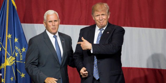 Presumptive US Republican presidential candidate Donald Trump (R) and Indiana Governor Mike Pence (L) take the stage during a campaign rally at Grant Park Event Center in Westfield, Indiana, on July 12, 2016. / AFP / Tasos KATOPODIS (Photo credit should read TASOS KATOPODIS/AFP/Getty Images)
