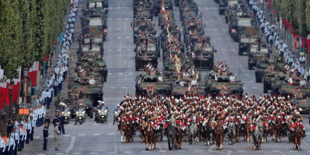 French soldiers parade the Champs Elysees avenue, with the Arc de Triomphe in background, during the Bastille Day parade in Paris, Thursday, July 14, 2016. (AP Photo/Francois Mori)