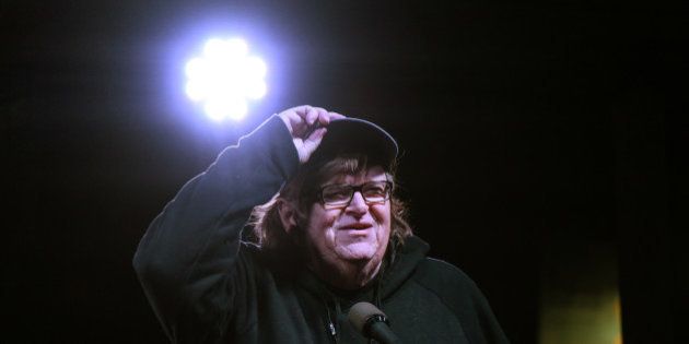 Michael Moore speaks at a protest against U.S. President-elect Donald Trump outside the Trump International Hotel in New York City, U.S. January 19, 2017. REUTERS/Stephanie Keith