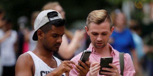 NEW YORK, NY - JULY 13: People play Pokemon GO game in New York City, NY on July 13, 2016. Pokemon Go is a free-to-play location-based augmented reality mobile game which allows players to capture, battle, and train virtual Pokemon who appear throughout the real world. Pokemon Go was rolled out to iPhone and Android smartphone users in the United States, Australia and New Zealand on July 6. (Photo by Volkan Furuncu/Anadolu Agency/Getty Images)