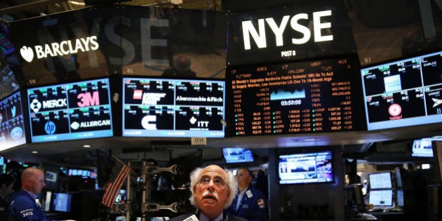 NEW YORK, NY - JUNE 20: Traders work on the floor of the New York Stock Exchange (NYSE) on June 20, 2014 in New York City. Markets enjoyed another strong week with the S&P 500 and the Dow Jones Industrial Average both closing at record highs on Friday. The S&P 500 rose to 1,962.87 whilethe Dow climbed to 16,947.08. (Photo by Spencer Platt/Getty Images)