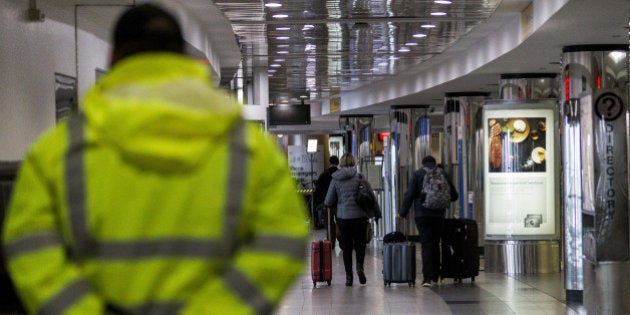 Travelers pull luggage at LaGuardia Airport (LGA) in New York, U.S., on Tuesday, March 14, 2017. A slight wobble in the path of a late-winter stormÂ will mean more rain and sleet and less snow than predicted for New York and the U.S. East Coast even as the system grows in strength on its journey north. Photographer: Jeenah Moon/Bloomberg via Getty Images