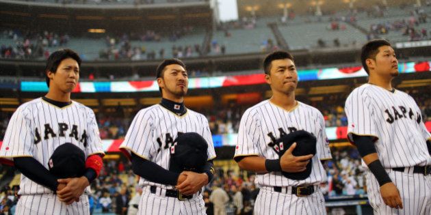 LOS ANGELES, CA - MARCH 21: Tetsuto Yamada #23, Ryosuke Kikuchi #4, Norichika Aoki #7 and Yoshitomo Tsutsugoh #25 of Team Japan are seen during introductions before Game 2 of the Championship Round of the 2017 World Baseball Classic against Team USA on Tuesday, March 21, 2017 at Dodger Stadium in Los Angeles, California. (Photo by Alex Trautwig/WBCI/MLB Photos via Getty Images)