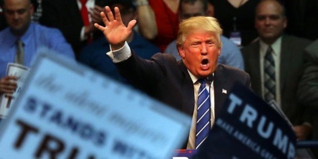 Republican presidential candidate Donald Trump energizes the crowd during a campaign rally at Dorton Arena in Raleigh, N.C., Friday, Dec. 4, 2015. (AP Photo/Ted Richardson)