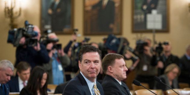 UNITED STATES - MARCH 20: FBI Director James Comey, left, and Director of the National Security Agency Adm. Mike Rogers, prepare to testify during a House Intelligence Committee hearing in Longworth Building on Russian interference with the 2016 election, March 20, 2017.(Photo By Tom Williams/CQ Roll Call)