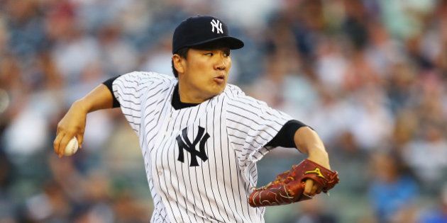 NEW YORK, NY - JUNE 17: Masahiro Tanaka #19 of the New York Yankees pitches against the Toronto Blue Jays in the first inning during their game at Yankee Stadium on June 17, 2014 in the Bronx borough of New York City. (Photo by Al Bello/Getty Images)