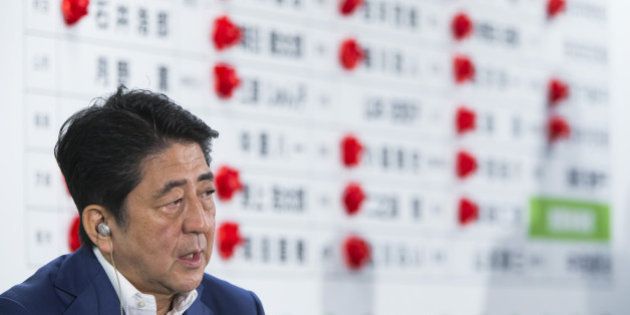 Shinzo Abe, Japan's prime minister and president of the Liberal Democratic Party (LDP), speaks to the media after the upper house election at the party's headquarters in Tokyo, Japan, on Sunday, July 10, 2016. Abe's conservative ruling coalition and its allies appear set to expand their majority in Sunday's upper house election, an NHK exit poll showed, and may win a two-thirds majority that will allow him to press ahead with plans to revise the pacifist constitution. Photographer: Tomohiro Ohsumi/Bloomberg via Getty Images