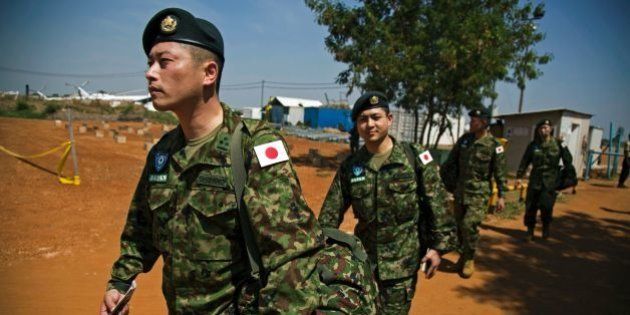 Members of the Japanese Ground Self-Defence Force (GSDF) arrive at the base at the compound of the United Nations peacekeeping mission (UNMISS) in Juba, South Sudan, on November 21, 2016.A United Nations plane landed in the morning at Juba airport with 60 new Japanese peacekeepers as the first group of the 350-strong unit, which will replace the current Japanese troops at the UN mission in South Sudan. The group, mostly engineers, will construct roads and facilities and are also assigned for the first time under Japans new security law, which enables GSDF troops to use weapons to rescue UN staff under attack. / AFP / ALBERT GONZALEZ FARRAN (Photo credit should read ALBERT GONZALEZ FARRAN/AFP/Getty Images)