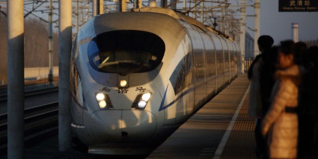 A China Railways high speed train arrives at Wuqing Railway Station in Tianjin, China, on Wednesday, March 11, 2015. Premier Li Keqiang last week set this year's growth target at about 7 percent, which would be China's slowest full-year expansion since 1990. Photographer: Tomohiro Ohsumi/Bloomberg via Getty Images