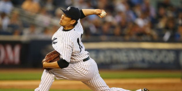 NEW YORK, NY - JUNE 17: Masahiro Tanaka #19 of the New York Yankees pitches against the Toronto Blue Jays in the third inning during their game at Yankee Stadium on June 17, 2014 in the Bronx borough of New York City. (Photo by Al Bello/Getty Images)