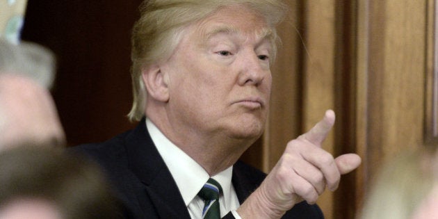 U.S. President Donald J. Trump gestures during the Friends of Ireland Luncheon at the U.S Capitol in Washington, D.C., U.S., on Thursday, March 16, 2017. As the Trump administration vows to upend international trade accords, including pulling out of the North American Free Trade Agreement, German Chancellor Angela Merkel's government has redoubled its support for multilateral trade arrangements.Â Photographer: Olivier Douliery/Pool via Bloomberg