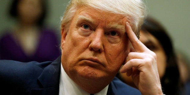 U.S. President Donald Trump looks up during a meeting about healthcare at the White House in Washington, U.S., March 13, 2017. REUTERS/Kevin Lamarque