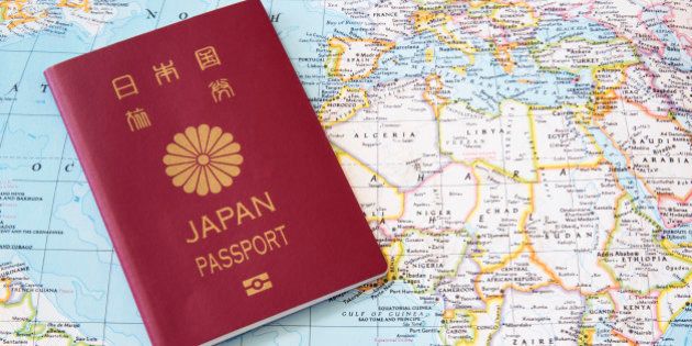 Japanese passport on a world map